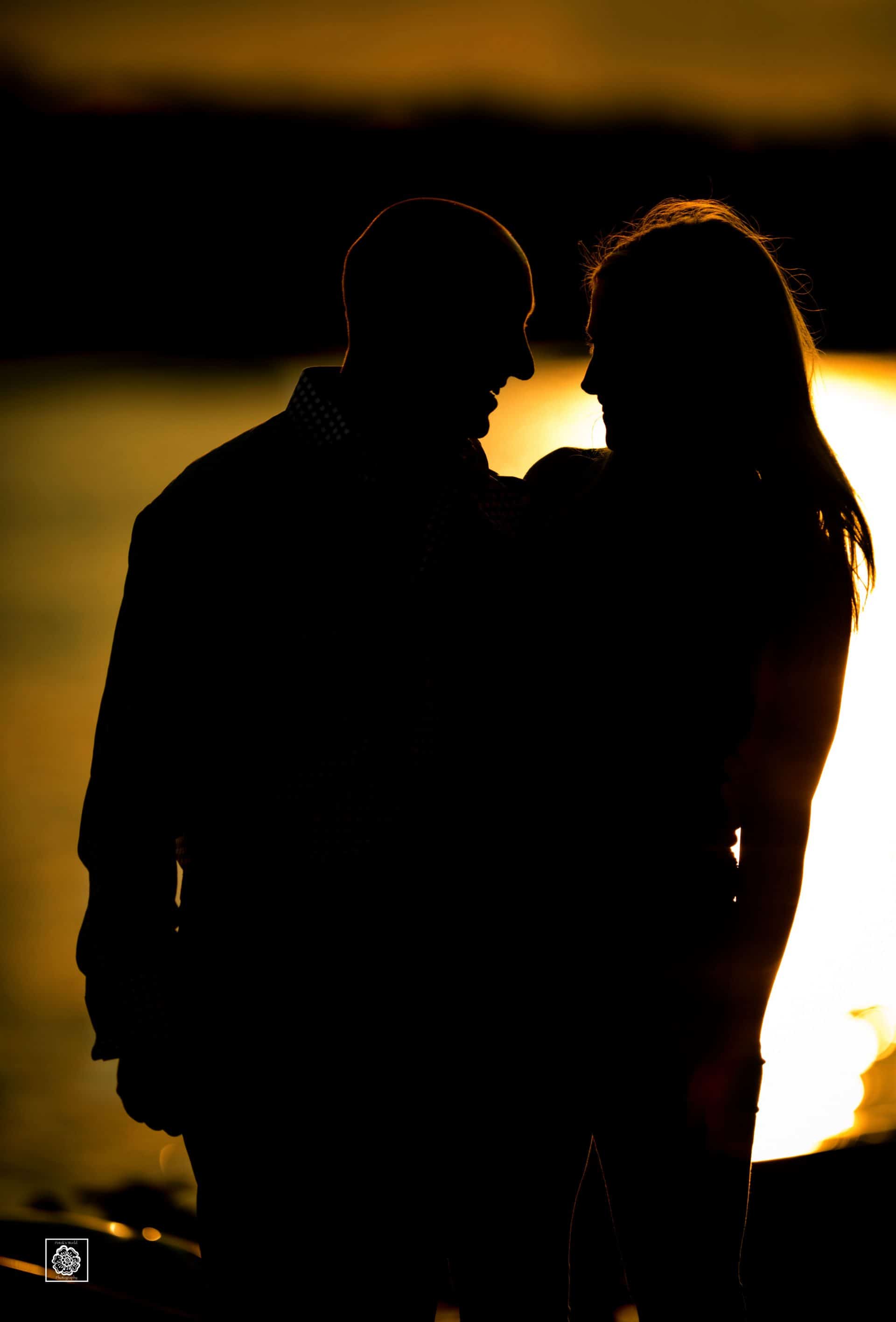 Sunset engagement photo silhouette at the Georgetown waterfront by DC wedding photographers of Potok's World Photography