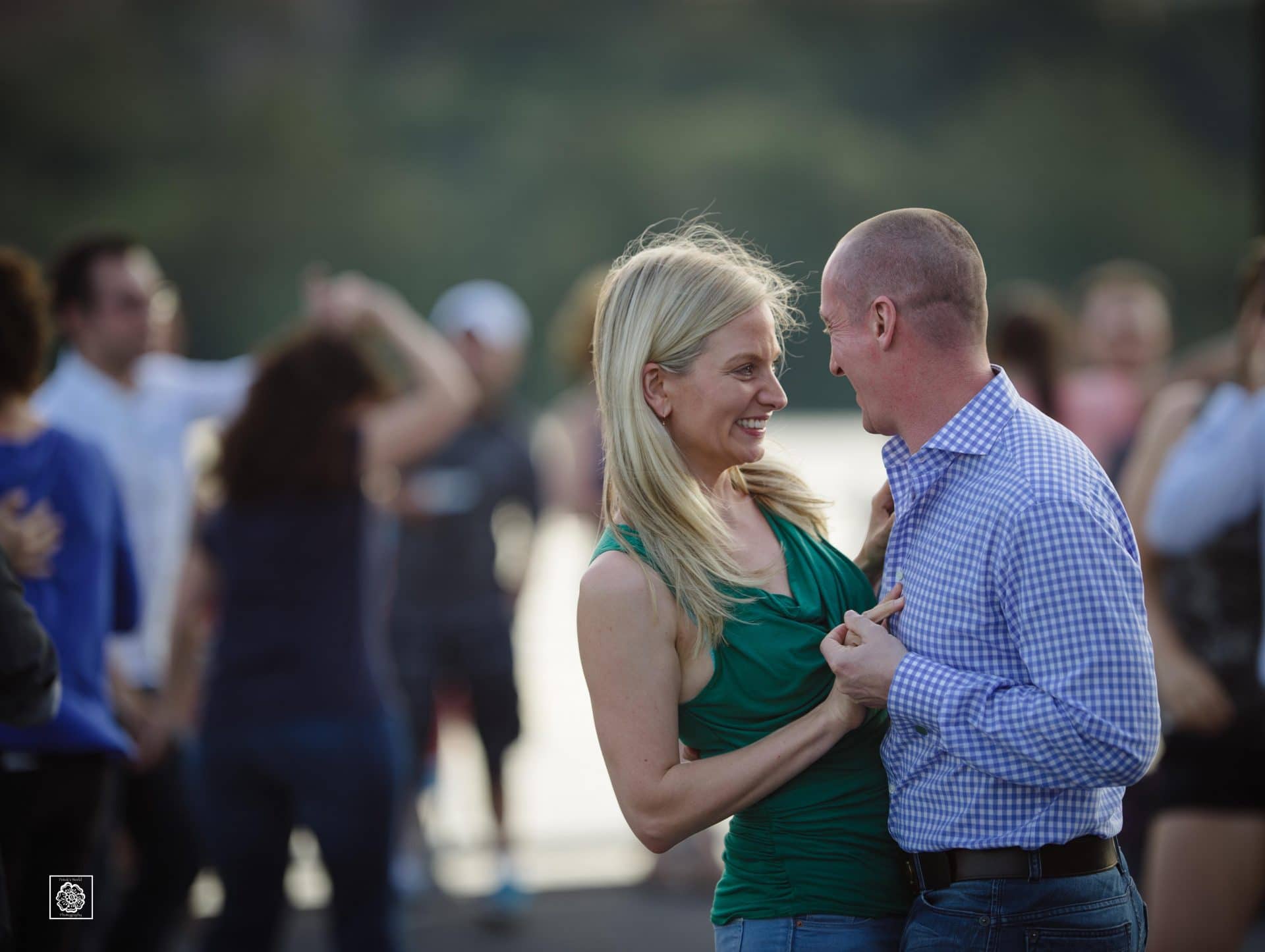 Couple sharing a moment during engagement photo session at the Georgetown waterfront by DC wedding photographers of Potok's World Photography