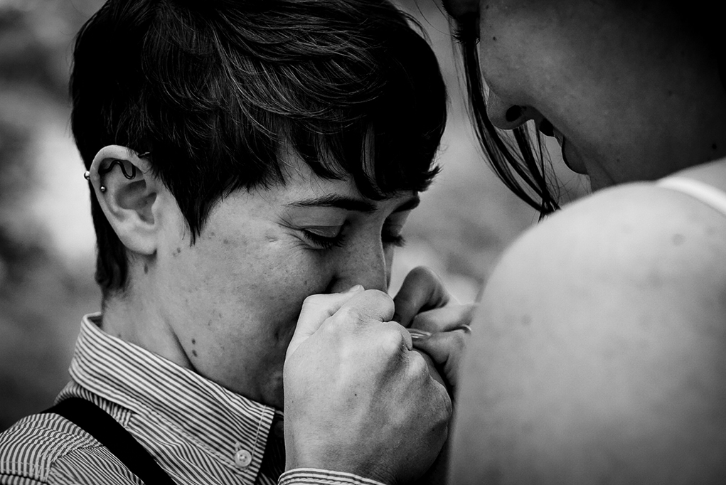 Tender moment between two brides to be during their Great Falls engagement photos by Potok's World Photography, engagement photographers in Maryland