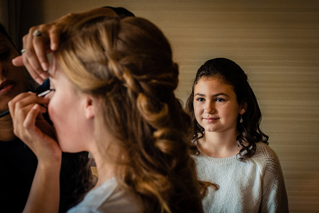 Bride getting ready with flower girl watching at Omni Shoreham DC wedding by DC wedding photographers of Potok's World Photography