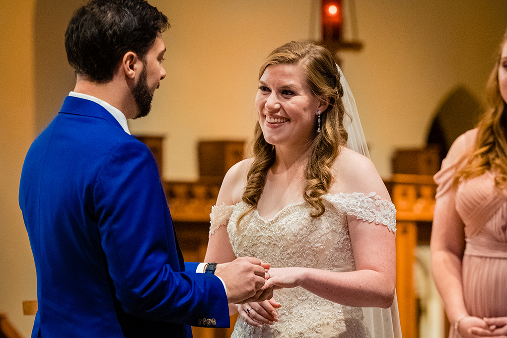 Bride and groom ring exchange at Dahlgren Chapel at Georgetown University before Omni Shoreham DC by DC wedding photographers Potok's World Photography