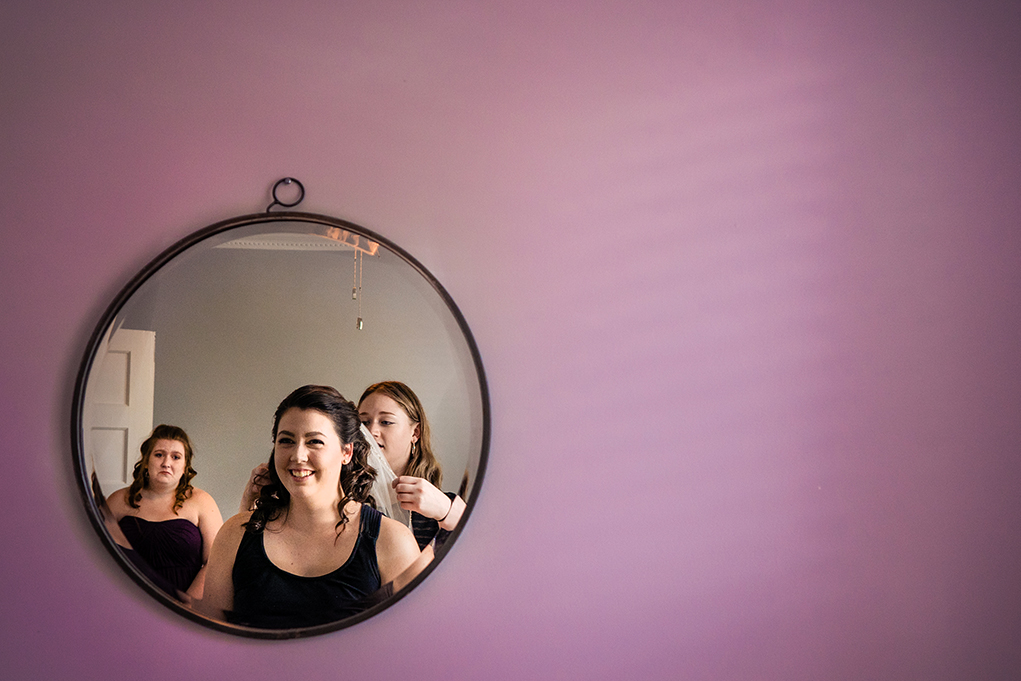 Bride getting ready with her sisters before wedding at the City Club of Washington by DC Wedding photographers Potok's World Photography