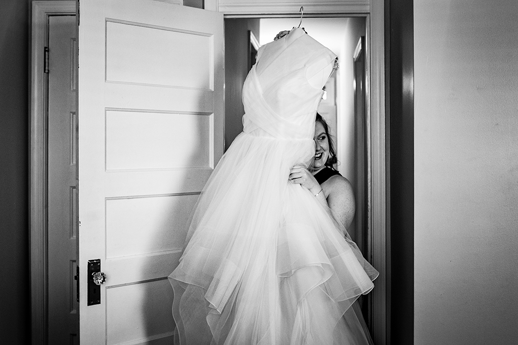 Bride getting ready with Hayley Page wedding dress before City Club of Washington wedding by DC wedding photographers of Potok's World Photography