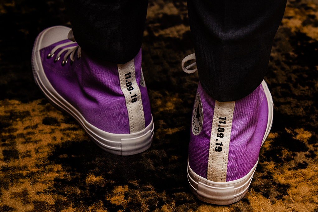 Cool Converse All-Stars/Chuck Taylors with wedding date on bridal feet at City Club of Washington wedding reception by DC wedding photographers Anji and Pete Martin of Potok's World Photography