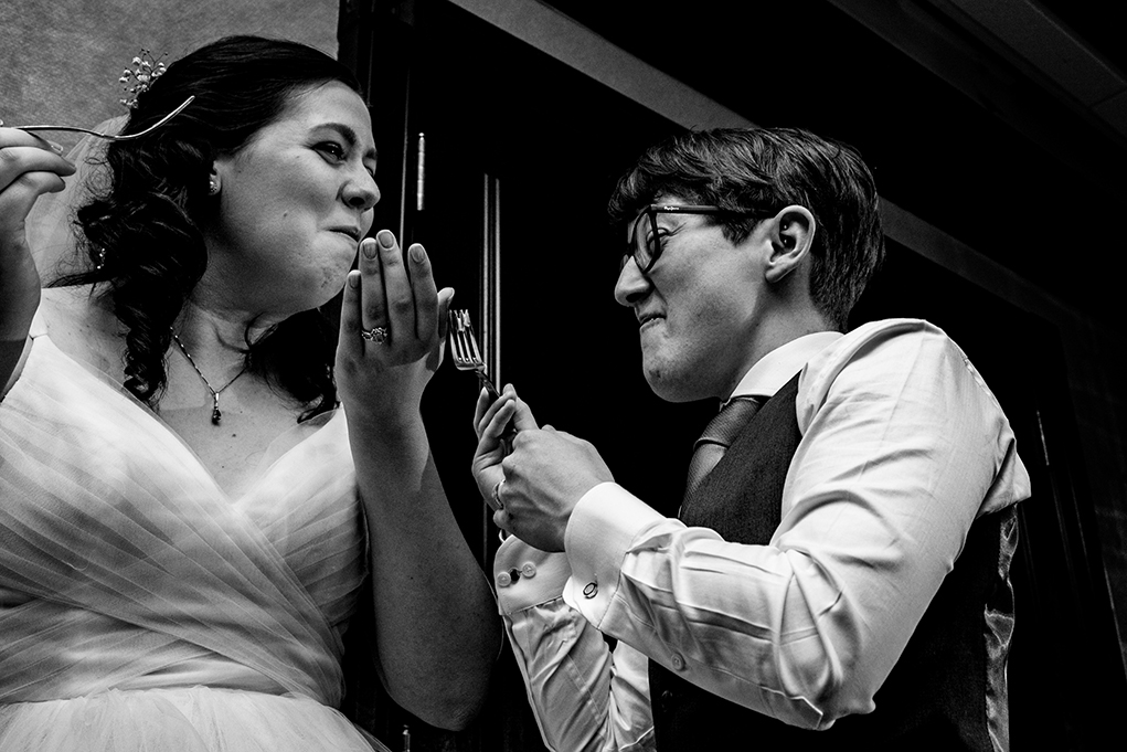 Brides cutting cake at City Club of Washington reception by DC wedding photographers Anji and Pete Martin of Potok's World Photography 