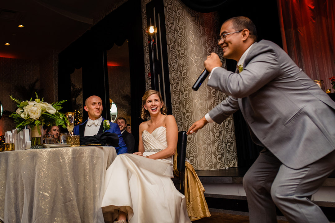 Best man speech with reaction from bride and groom at the Carlyle Club Alexandria wedding reception by DC wedding photographers of Potok's World Photography