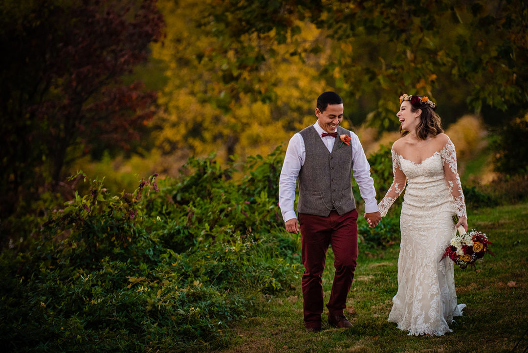 Wedding day timelime: Picture of a bride and groom holding hands at Bluemont Vineyard in Virginia by DC wedding photographer Potok's World Photography
