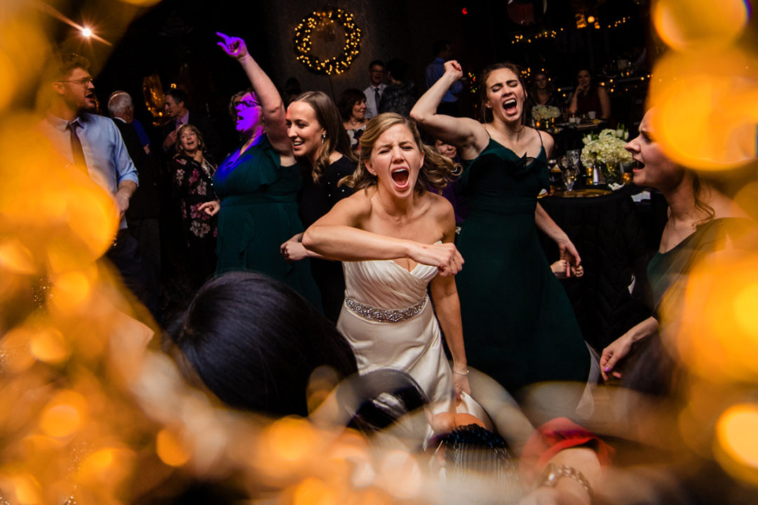 Bride and bridesmaids dancing at the Carlyle Club Alexandria by DC wedding photographers of Potok's World Photography