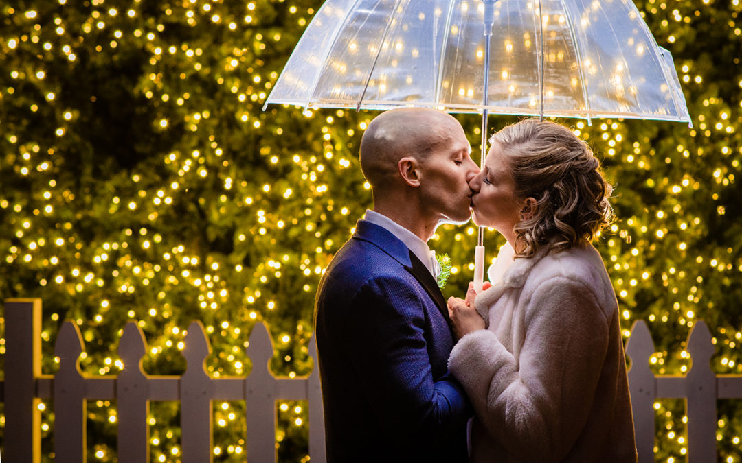 Bride and groom portrait in front of a Christmas tree in old town Alexandria before Carlyle Club reception by DC wedding photographers Potok's World Photography