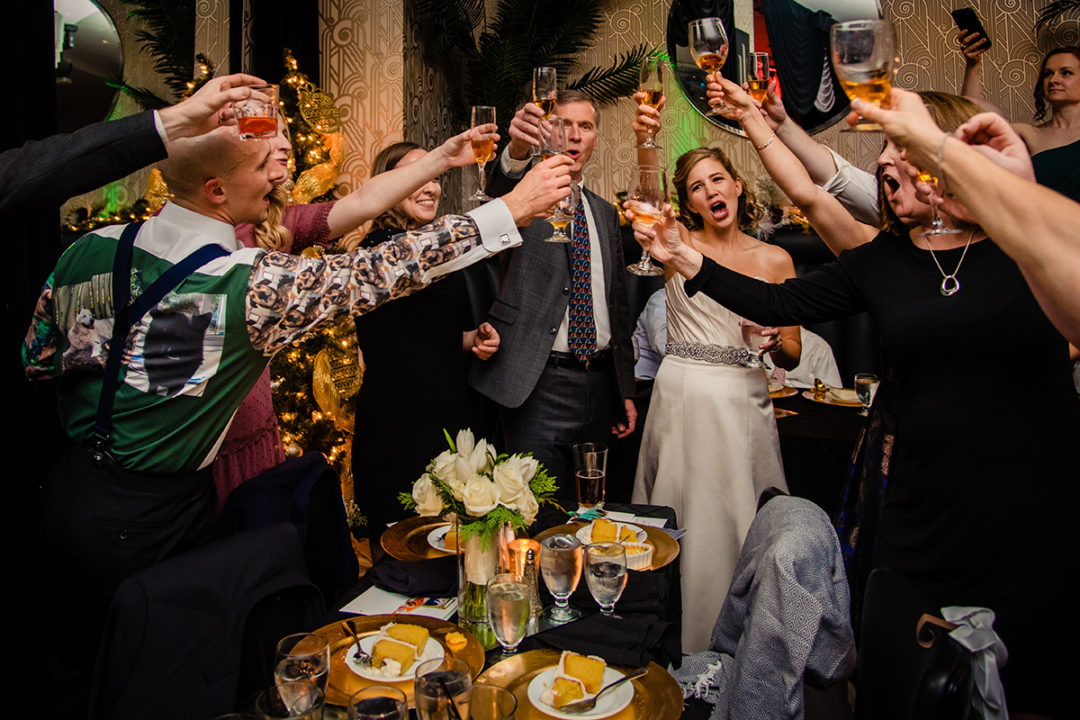 Bride and groom toast with their guests at Carlyle Club Alexandria by DC wedding photographers Potok's World Photography