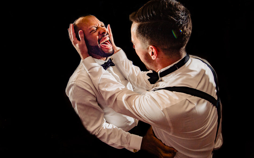 Documentary wedding photography of moment two grooms dancing during wedding reception at Algonkian Golf Course in Virginia by Washington DC wedding photographer Anji Martin of Potok’s World Photography