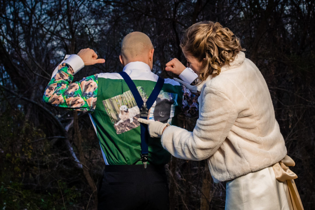 Groom surprises bride by wearing shirt with pictures of her dogs printed on the back in Old Town Alexandria by DC wedding photographer of Potok's World Photography