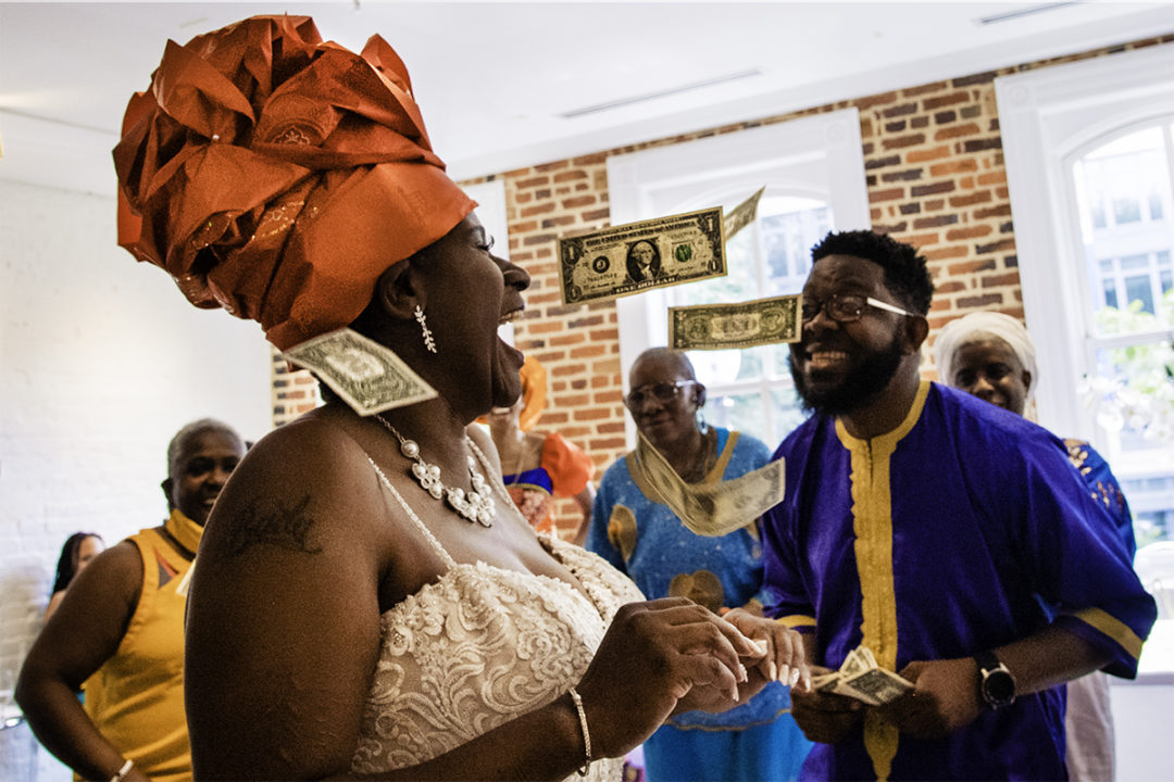  Money dance with Ghanaian bride during a Washington DC micro wedding at Fathom Gallery by Potok's World Photography