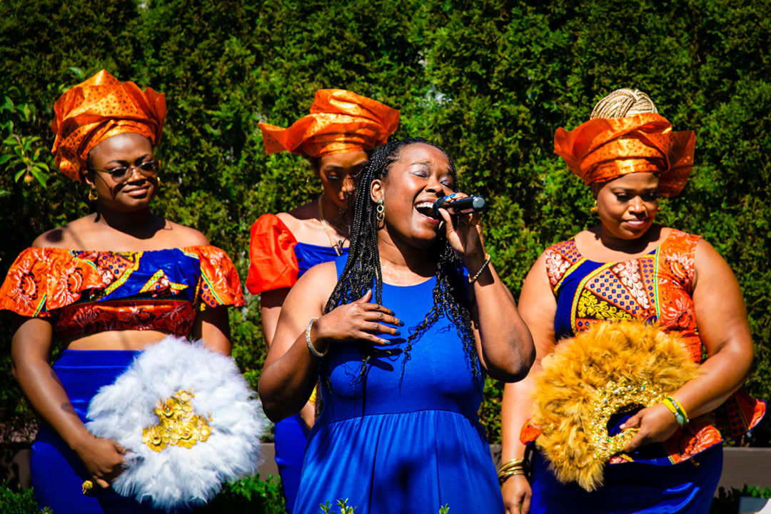  Sister of the groom singing "At Last" by Etta James during a Washington DC micro wedding ceremony at Fathom Gallery by Potok's World Photography