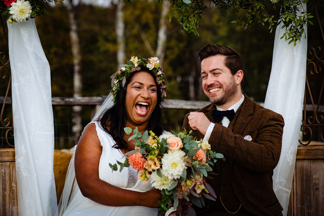 Documentary wedding photography of bride and groom sharing a moment after outdoor ceremony at an Alpaca Farm by Anji and Pete Martin of Potok’s World Photography, Washington DC wedding photographers