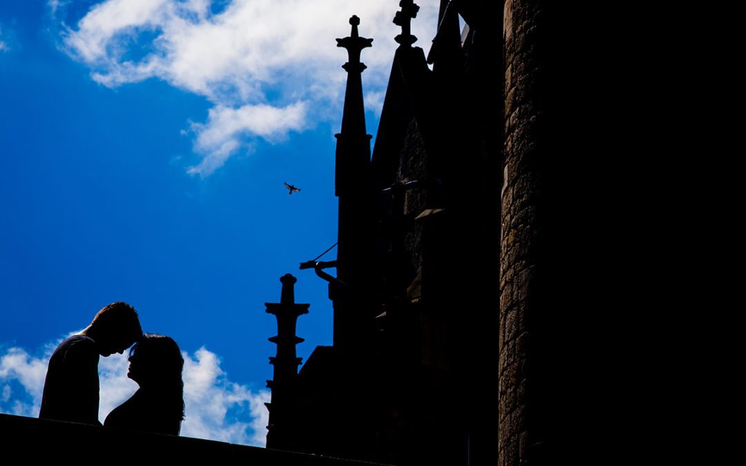 Silhouette of couple against clear blue sky during Marienburg Castle engagement photos in Germany by Washington DC wedding photographers Potok's World Photography