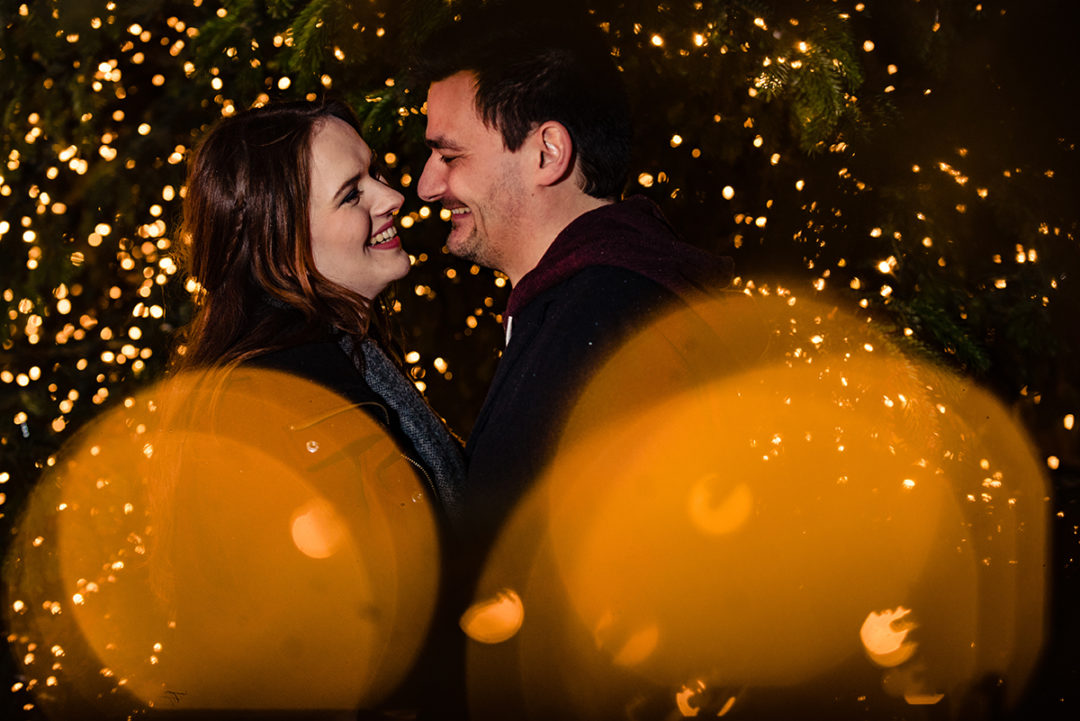 Tips for planning a winter engagement photoshoot at the Christmas market with seasonal lights by DC wedding photographer Potok's World Photography
