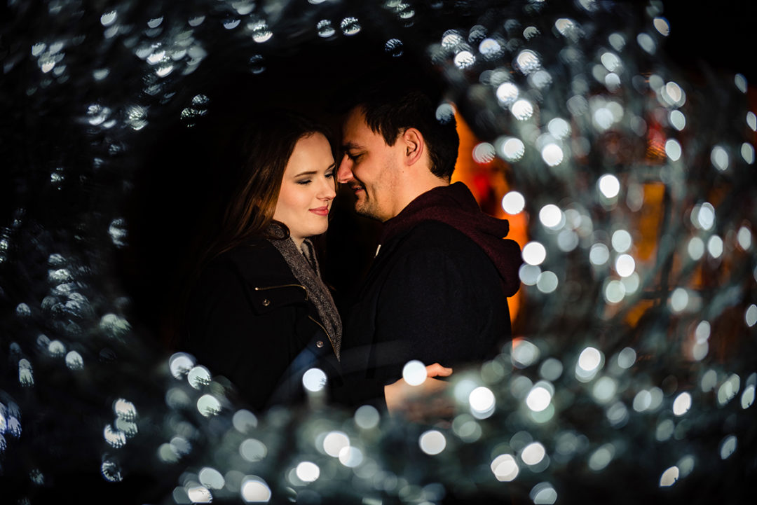 Tips for planning a winter engagement photoshoot at the Christmas market with seasonal lights by DC wedding photographer Potok's World Photography