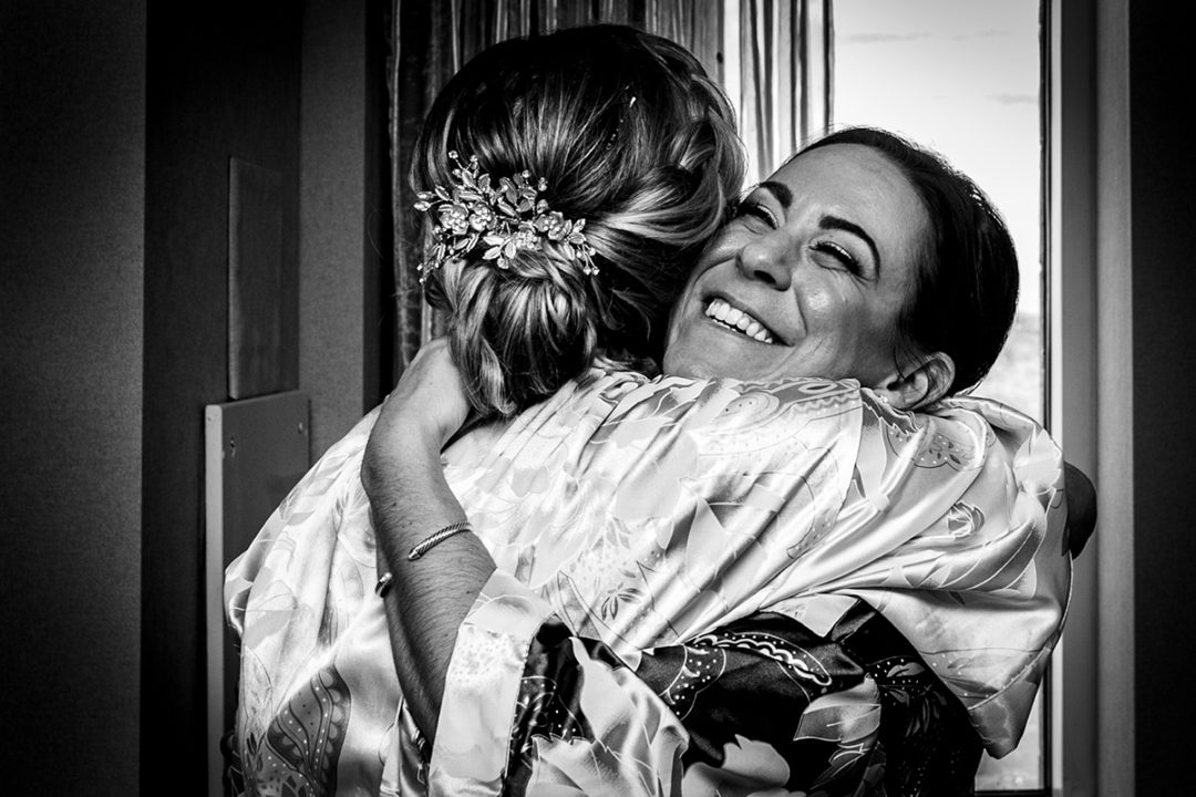 Bride getting ready with her bridesmaids at Lansdowne Resort and Spa in Leesburg before her Vanish Brewery wedding by DC wedding photographers Potok's World Photography