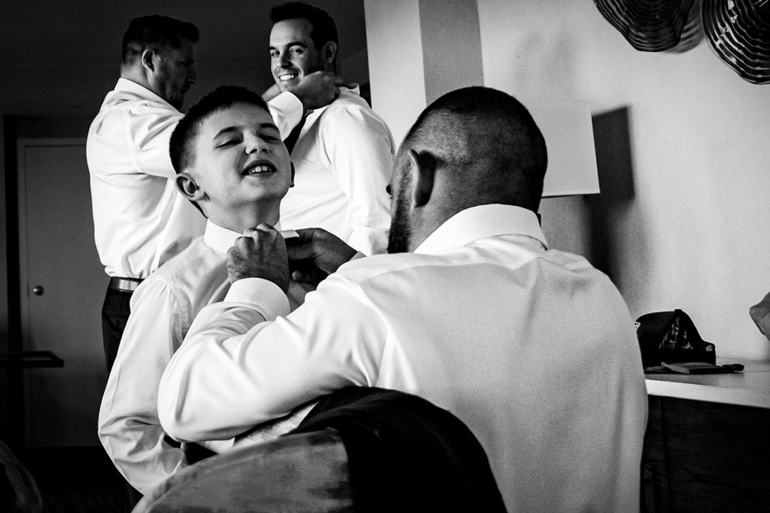 Groom and groomsmen getting ready at Landsdowne Spa and Resort in Leesburg before the Vanish Brewery wedding by DC wedding photographer Pete Martin of Potok's World Photography