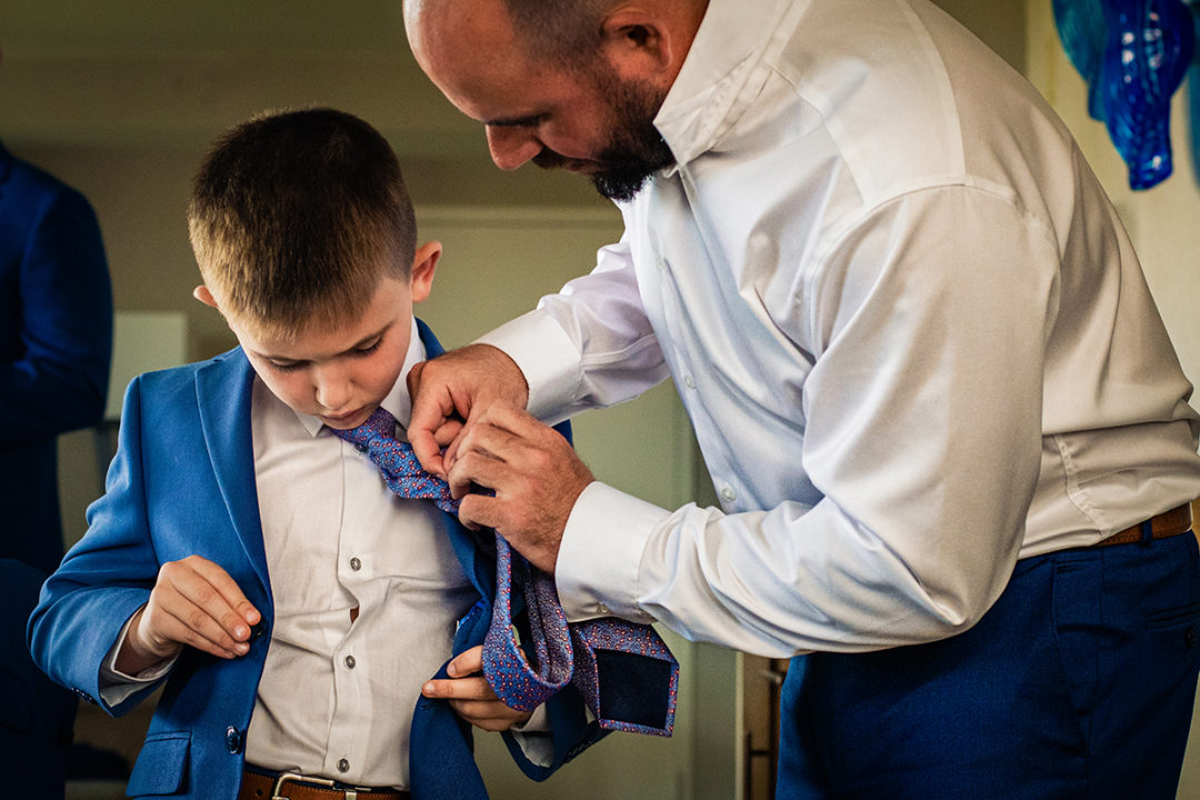 Groom and groomsmen getting ready at Landsdowne Spa and Resort in Leesburg before the Vanish Brewery wedding by DC wedding photographer Pete Martin of Potok's World Photography