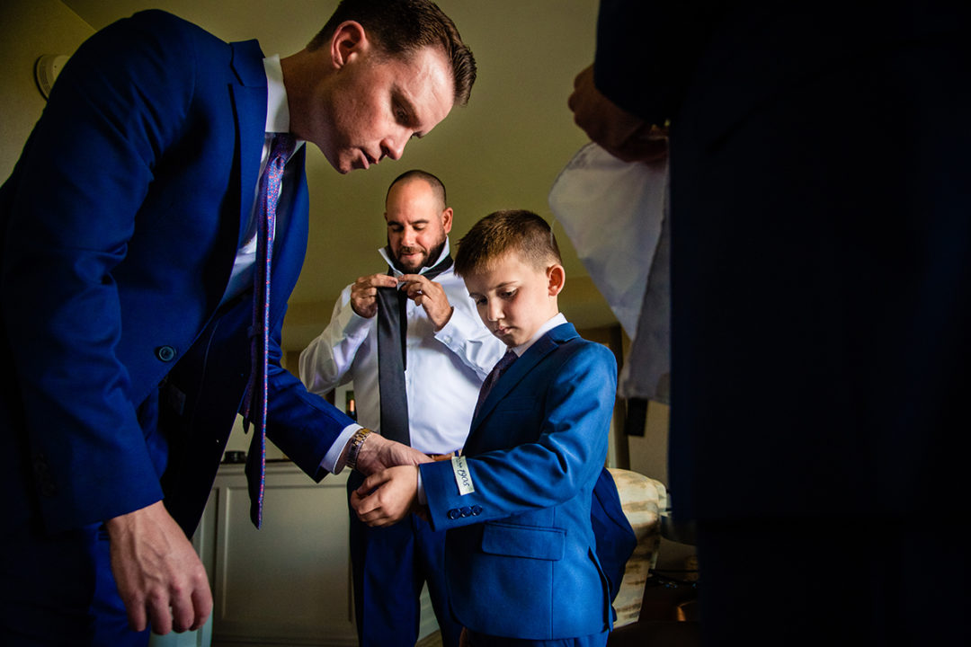 Groom and groomsmen getting ready at Landsdowne Spa and Resort in Leesburg before the Vanish Brewery wedding by DC wedding photographer Pete Martin of Potok's World Photography