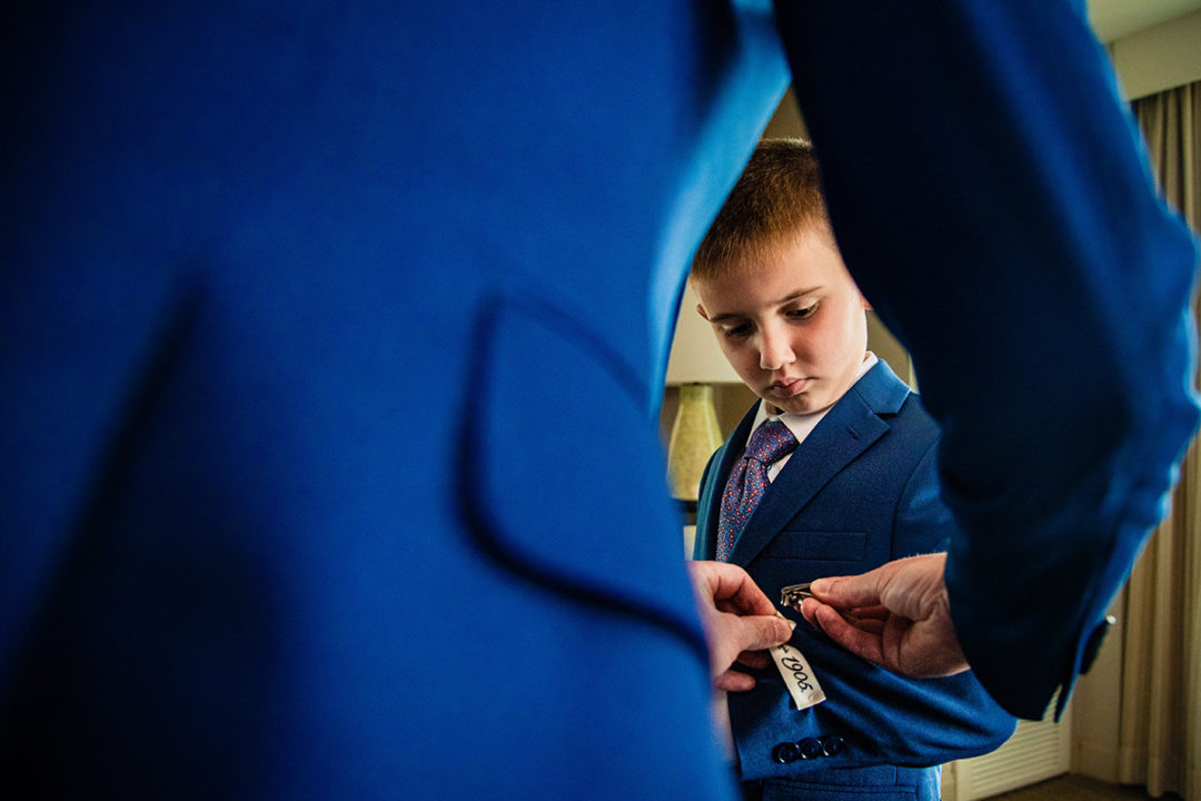 Groom and groomsmen getting ready at Landsdowne Spa and Resort in Leesburg before the Vanish Brewery wedding by DC wedding photographer Pete Martin of Potok's World Photography