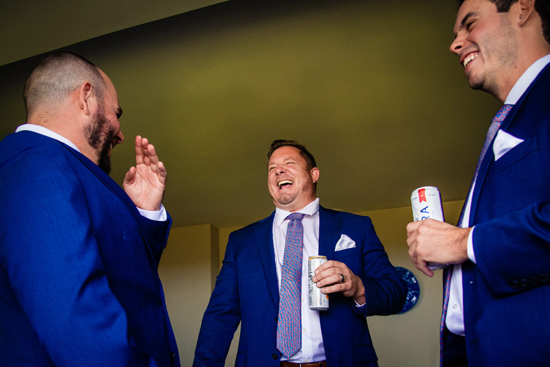 Groom and groomsmen getting ready at Landsdowne Spa and Resort in Leesburg before the Vanish Brewery wedding by DC wedding photographer Pete Martin of Potok's World Photography