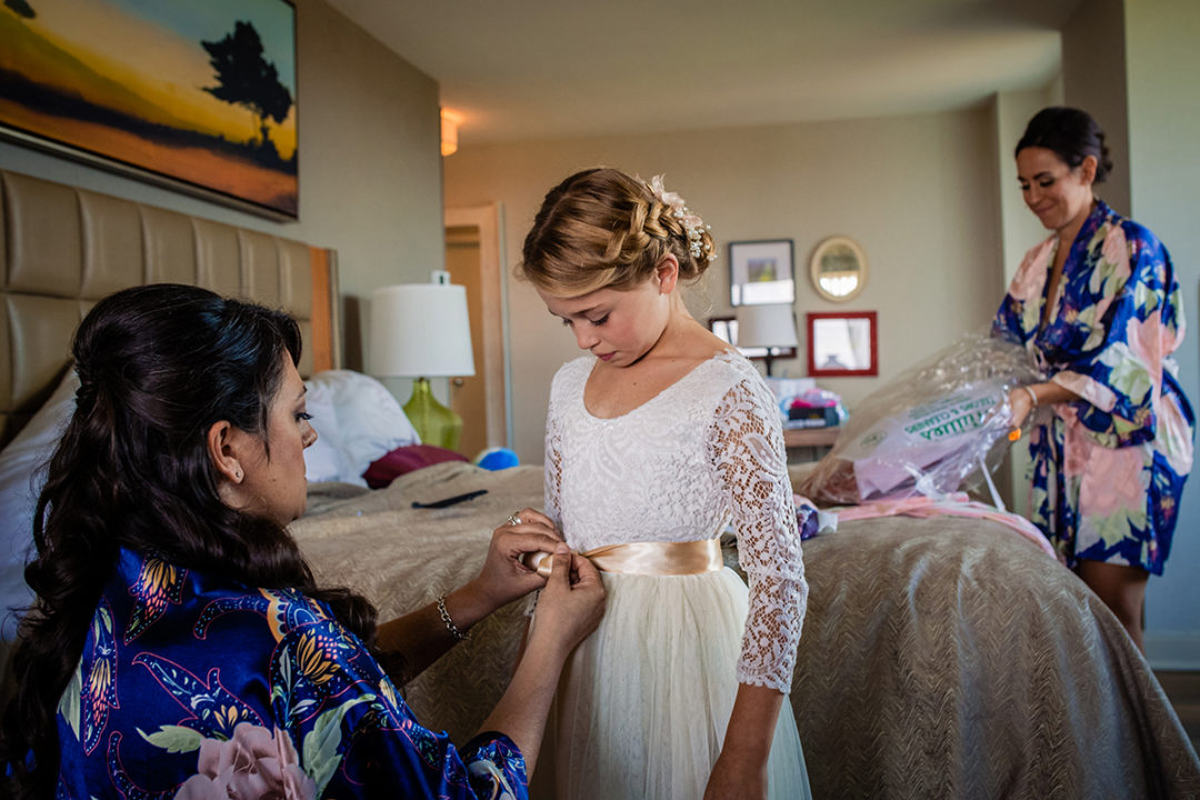 Bride getting ready with her bridesmaids at Lansdowne Resort and Spa in Leesburg before her Vanish Brewery wedding by DC wedding photographers Potok's World Photography