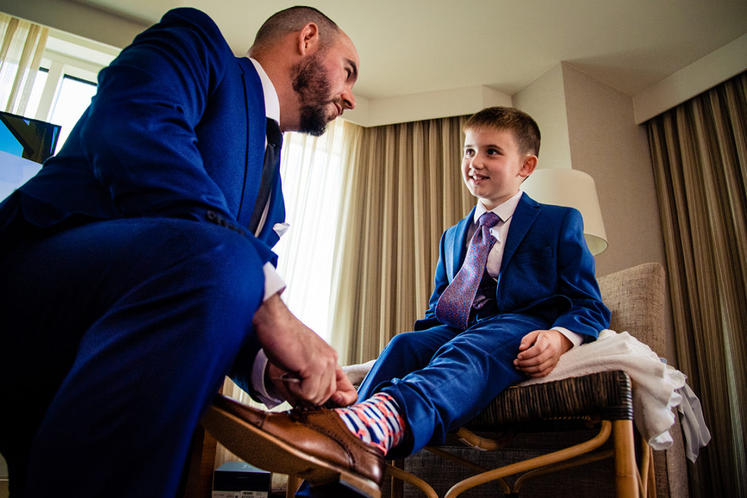 Groom and groomsmen getting ready at Landsdowne Spa and Resort in Leesburg before the Vanish Brewery wedding by DC wedding photographer Pete Martin of Potok's World Photography
