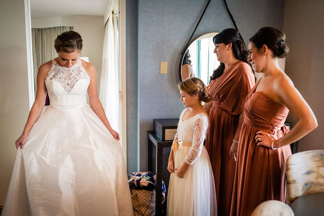 Bride getting ready with her bridesmaids at Lansdowne Resort and Spa in Leesburg before her Vanish Brewery wedding by DC wedding photographers Potok's World Photography