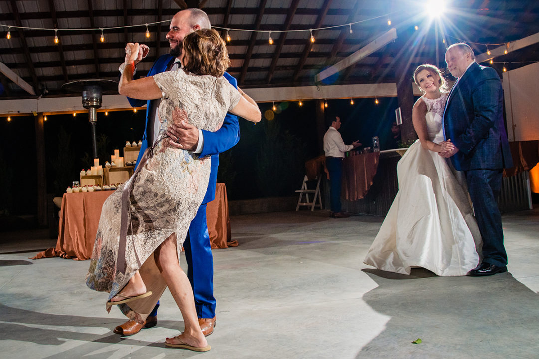 Parent dances at wedding reception at Vanish Brewery in Virginia by DC wedding photographer of Potok's World Photography