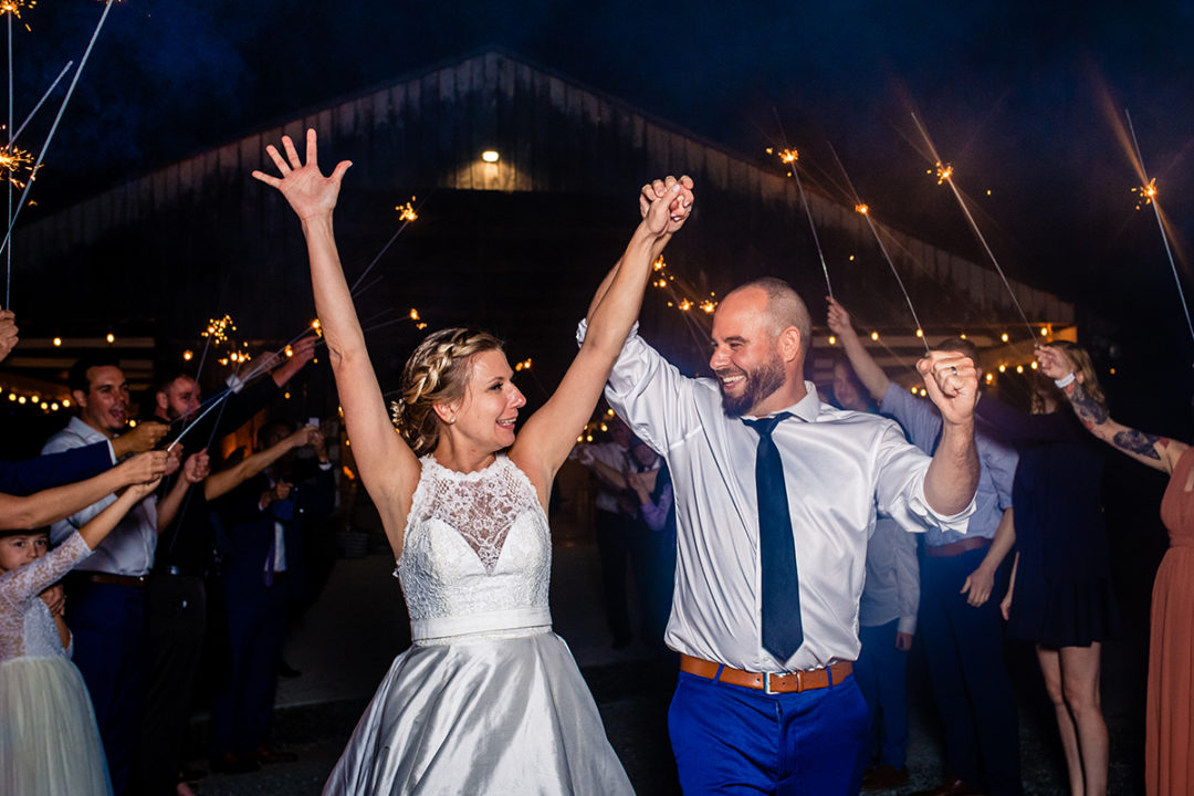 Couple doing their sparkler exit at Vanish Brewery wedding in Virginia by DC wedding photographer of Potok's World Photography 