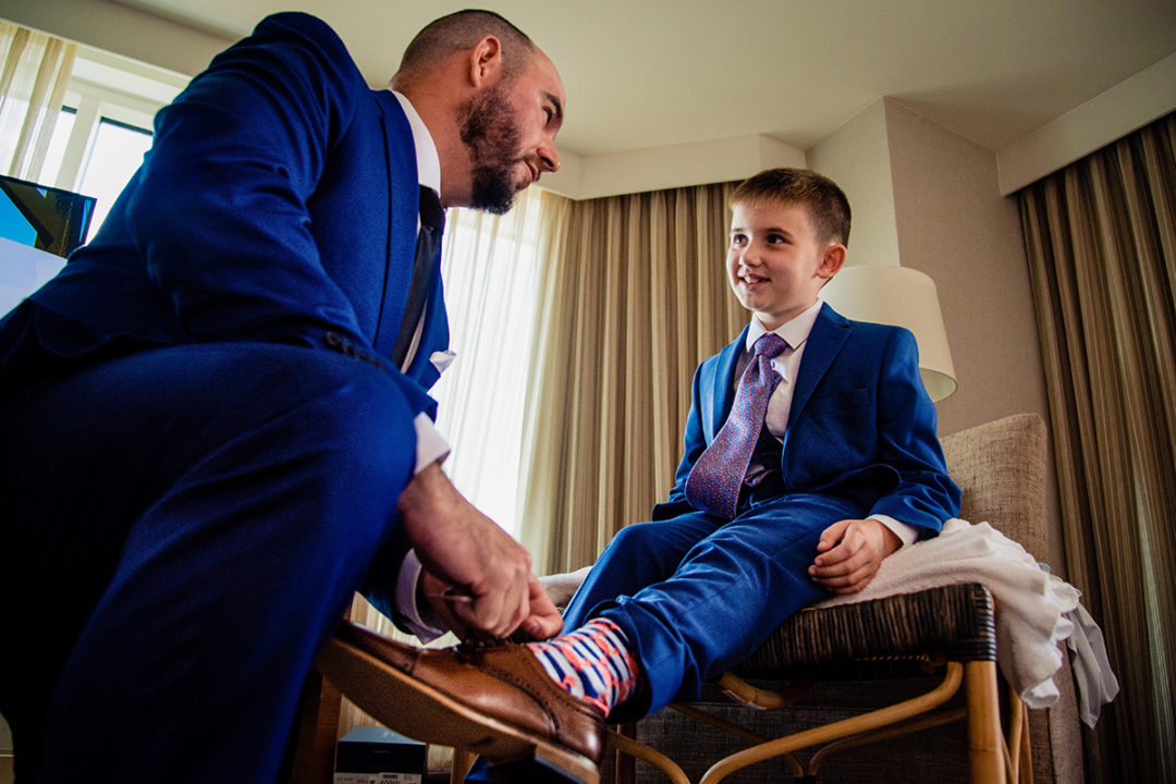 Groom getting ready moment at Lansdowne Resort in Virginia by DC wedding photographers of Potok's World Photography