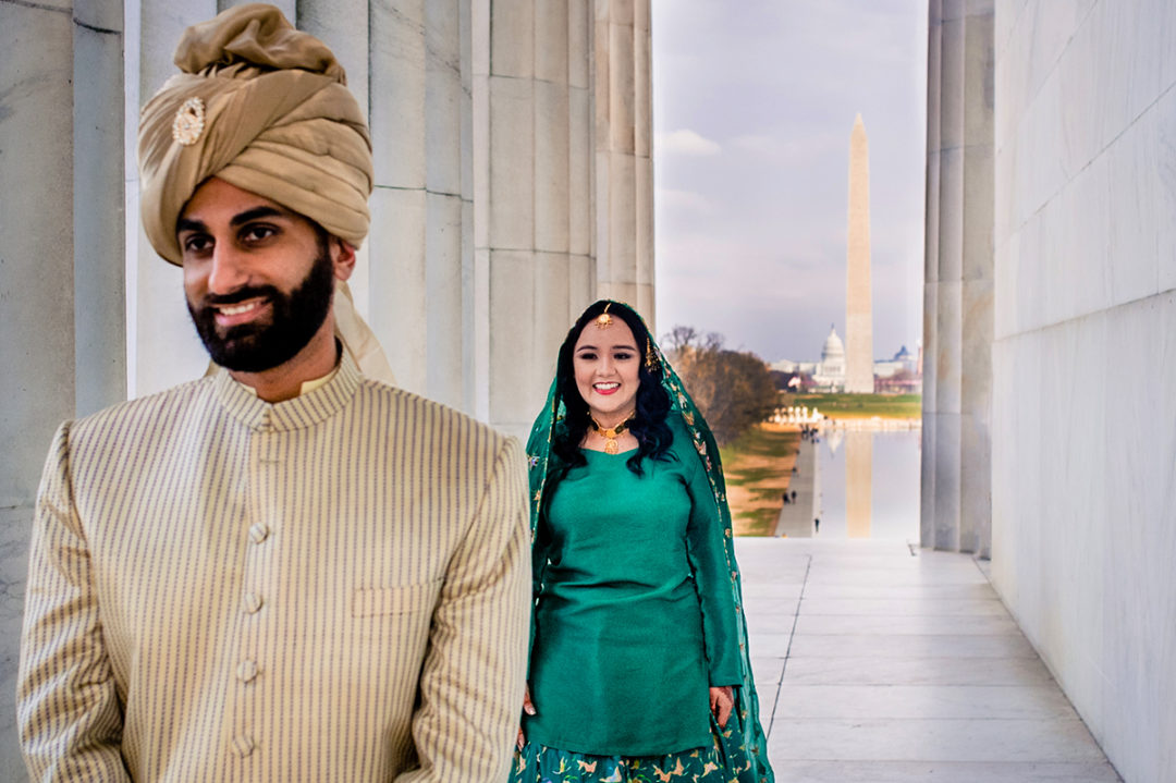South-asian bride and groom's first look at the Lincoln Memorial before their DC War Memorial mini wedding by Potok's World Photography