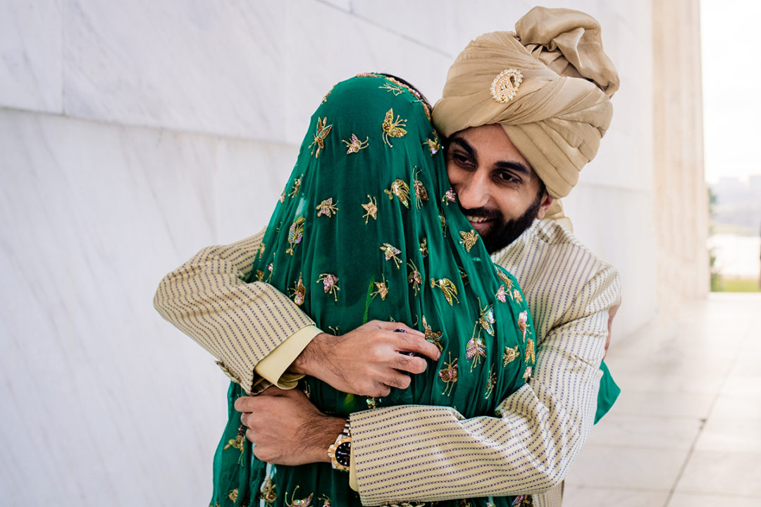 South-asian bride and groom's first look at the Lincoln Memorial before their DC War Memorial mini wedding by Potok's World Photography