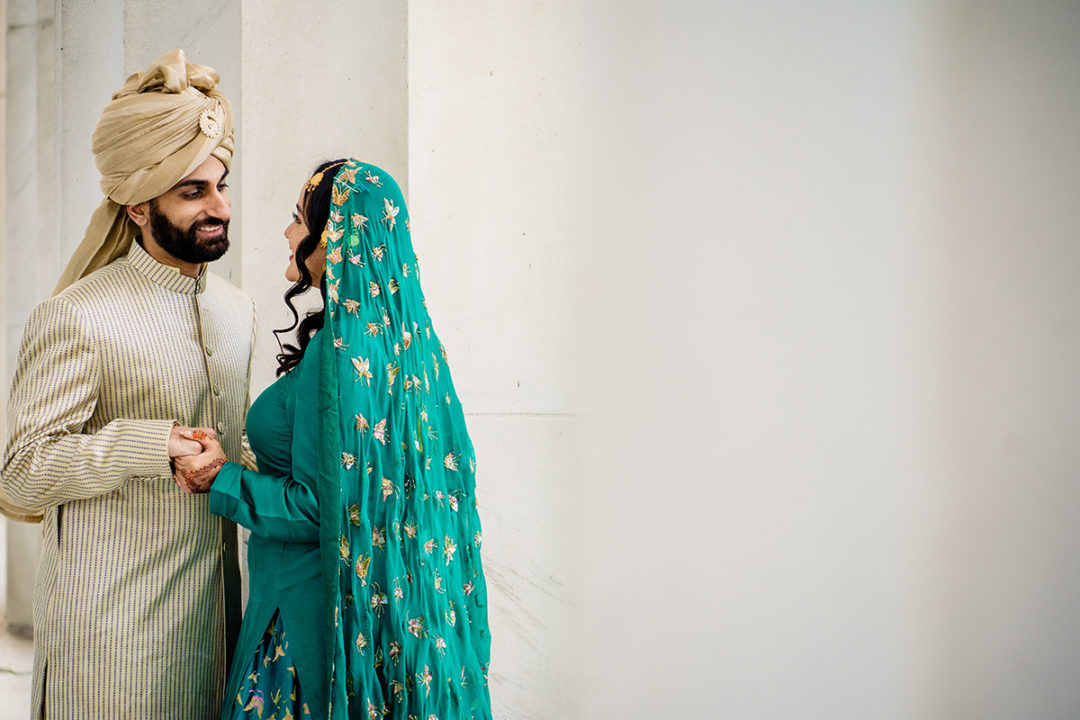 South-asian bride and groom portrait at the Lincoln Memorial before their DC War Memorial mini wedding by Potok's World Photography