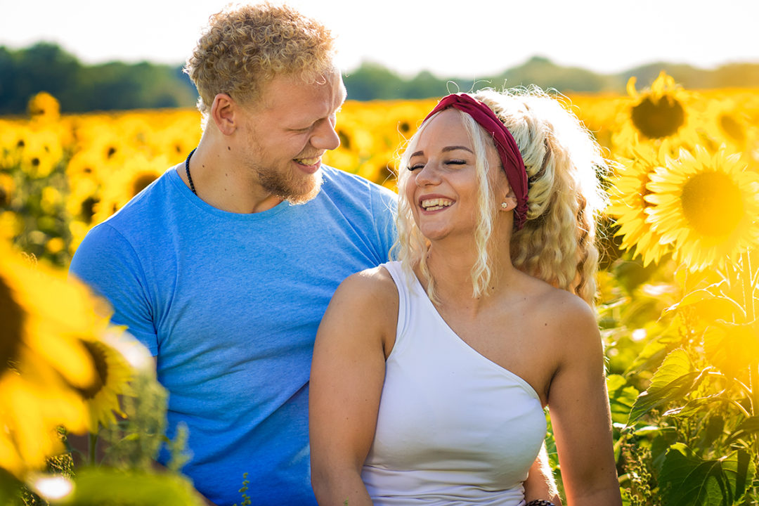 Sunflower field engagement session by DC wedding and elopement photographers of Potok's World Photography