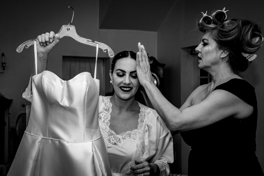 Bride getting ready with her mother before her Capitol Hill church wedding by DC wedding photographers of Potok's World Photography