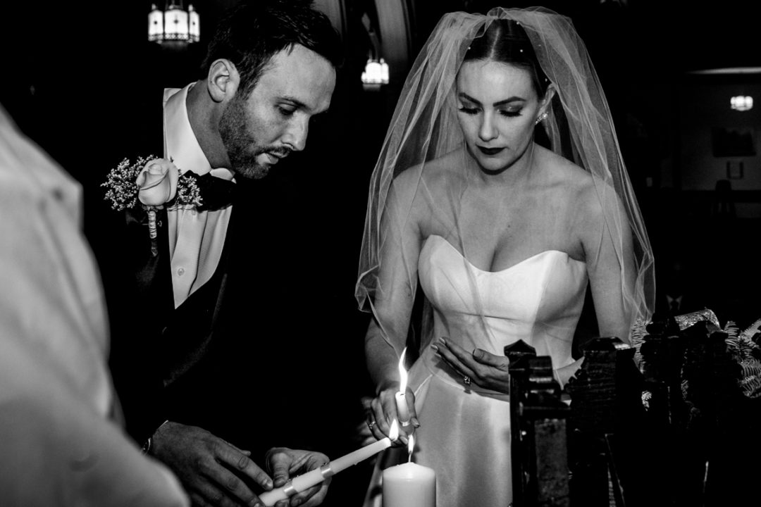 Lighting of unity candle during Capitol Hill church wedding ceremony by DC wedding photographers of Potok's World Photography
