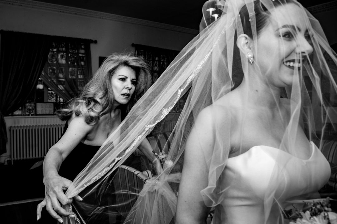 Bride getting ready with her mother before her Capitol Hill church wedding by DC wedding photographers of Potok's World Photography
