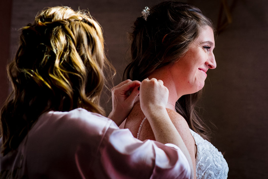 Getting ready moments with Bride and bridesmaid during destination wedding at the Windamere in Ohio by DC wedding photographers of Potok's World Photography