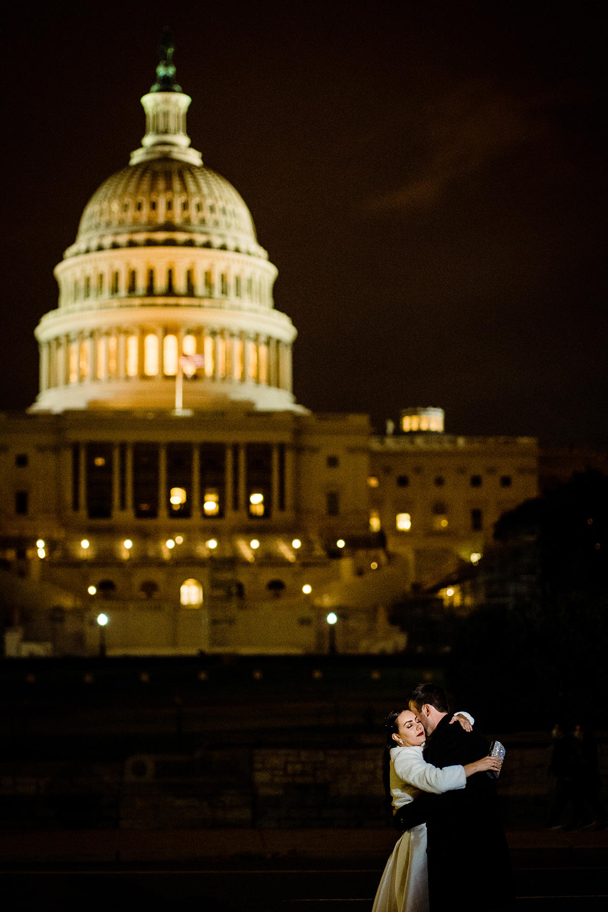 Nighttime Bride and groom portrait in front of the Capitol Building by DC wedding photographers of Potok's World Photography