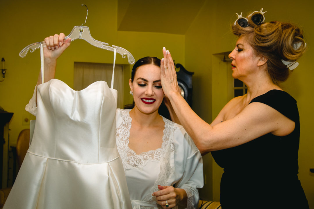 Bride getting ready with mom at Capitol Hill DC before church ceremony by DC wedding photographers of Potok's World Photography