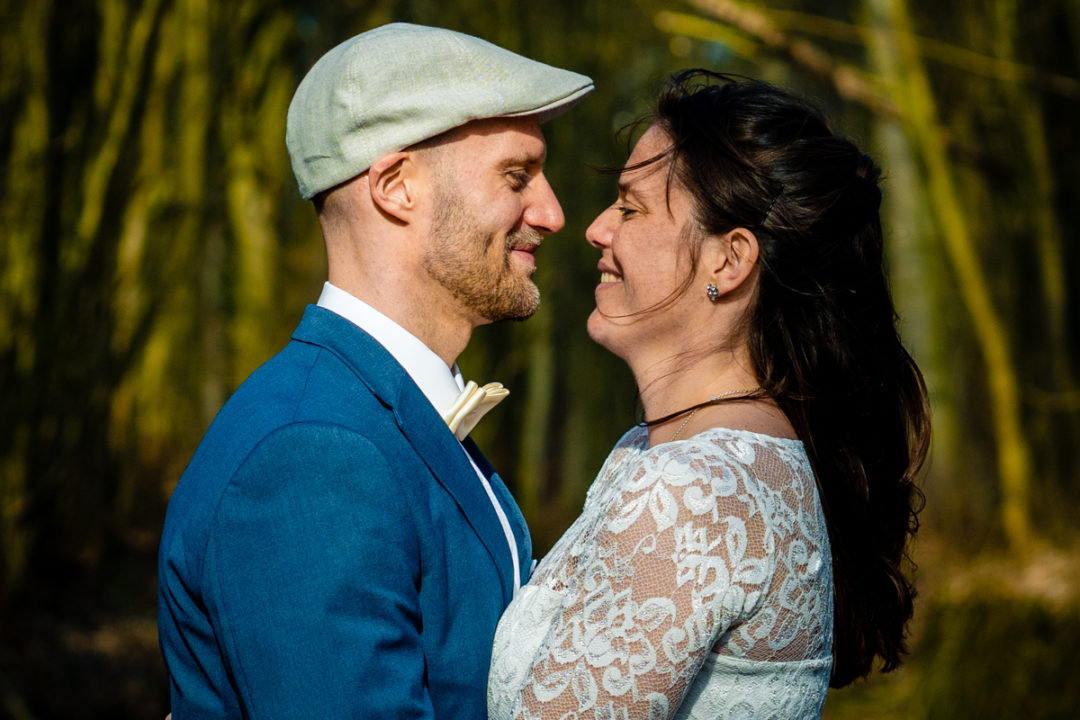 Couples portrait of bride and groom in the woods after micro wedding by DC wedding photographers of Potok's World Photography