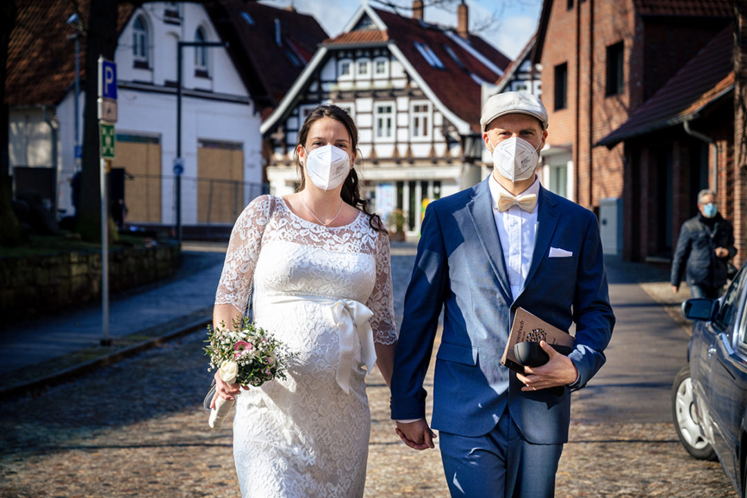 Bride and groom in masks for courthouse wedding during Covid-19 in Gehrden Germany by DC wedding photographers of Potok's World Photography