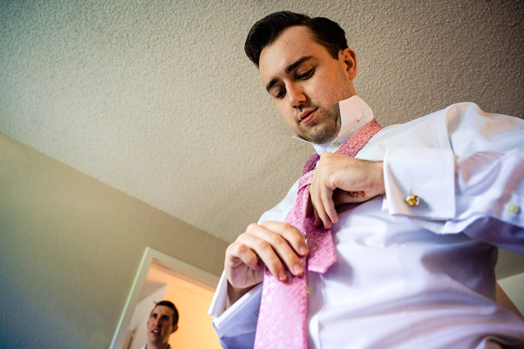 Groom and groomsmen getting ready at hotel before wedding ceremony at the Winery at Bull Run by DC wedding photographers of Potok's World Photography