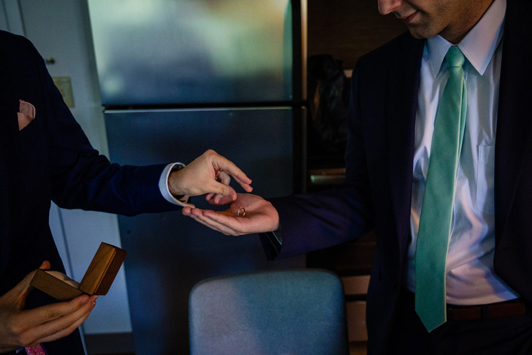 Groom and groomsmen getting ready at hotel before wedding ceremony at the Winery at Bull Run by DC wedding photographers of Potok's World Photography