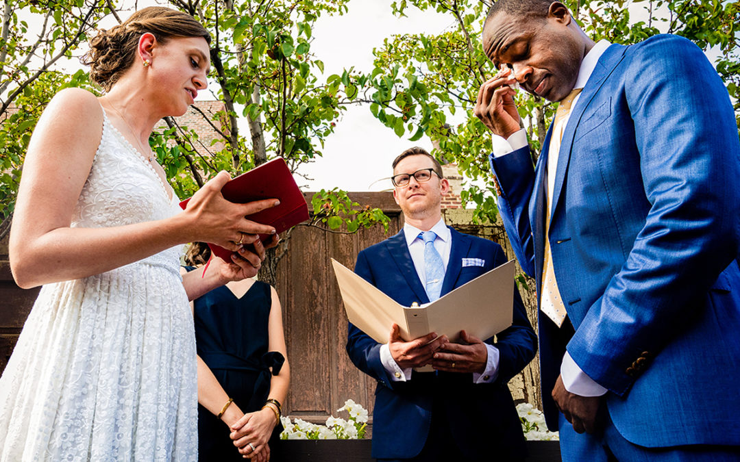 Couple exchanging vows at outdoor wedding ceremony at Fathom Gallery in DC by Potok's World Photography