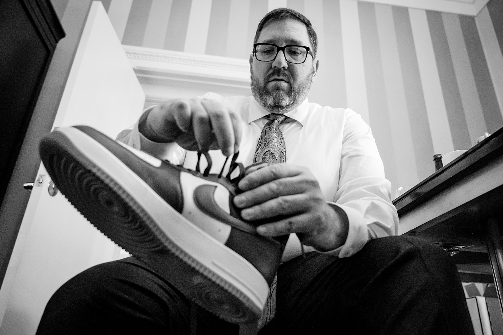 Groom getting ready at Hotel Monaco in Washington DC before the wedding ceremony by Potok's World Photography